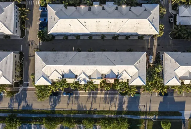 an aerial view of a house with a lake view
