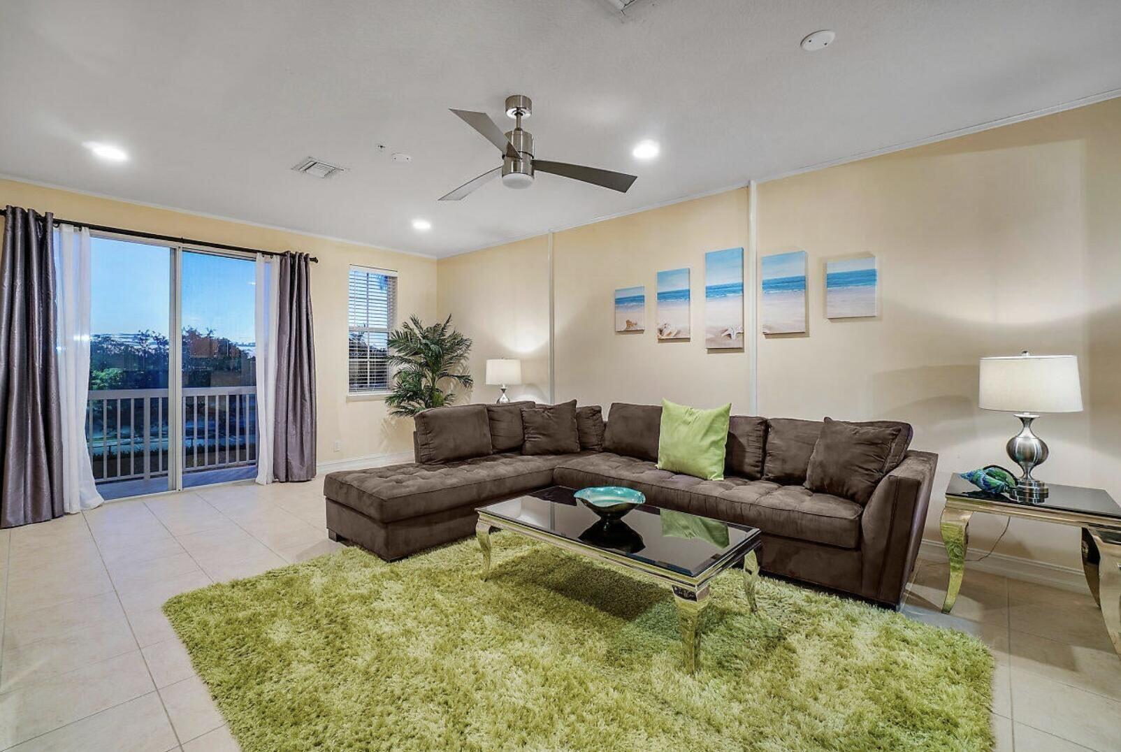 111 Southwest 2nd Avenue Delray Beach, FL 33444 - Photo 4 of 33 a living room with furniture and a large window