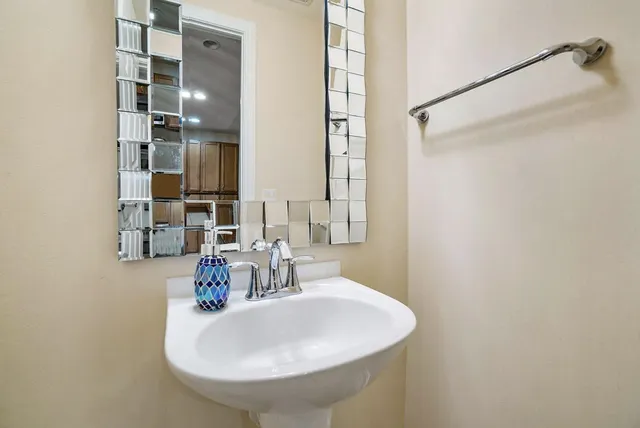 a bathroom with a sink and a mirror