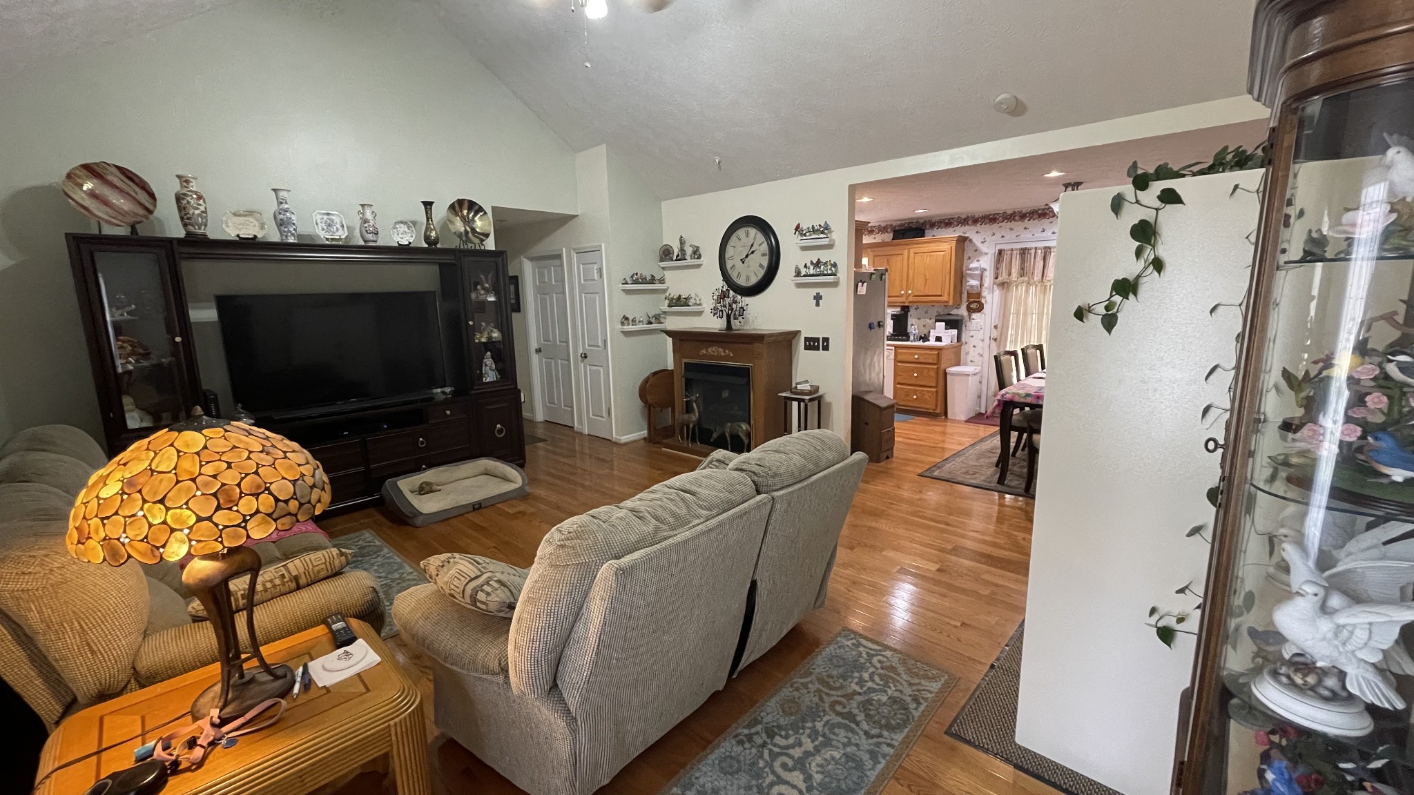 121 Fieldstone Lane Springfield, TN 37172 - Photo 4 of 21 a living room with furniture a flat screen tv and a fireplace