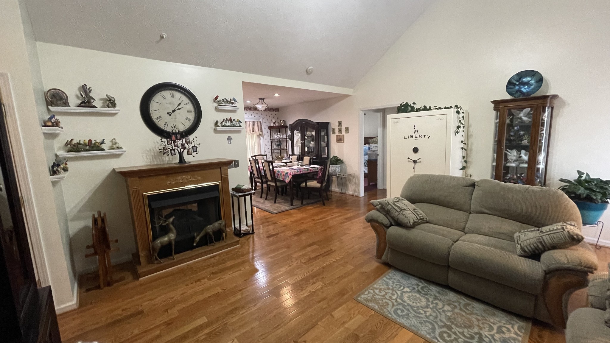 121 Fieldstone Lane Springfield, TN 37172 - Photo 5 of 21 a living room with furniture a clock and a fireplace