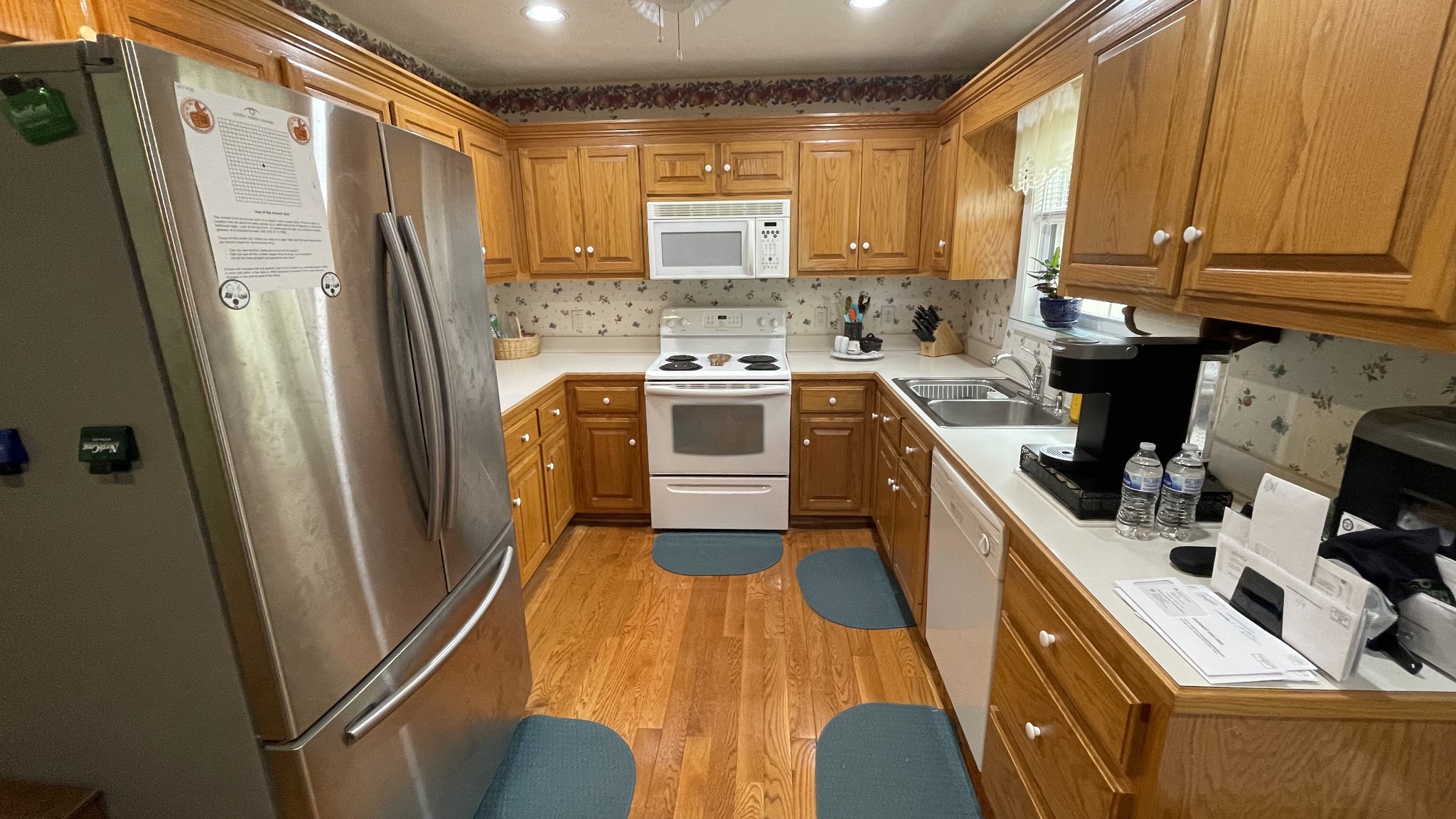 121 Fieldstone Lane Springfield, TN 37172 - Photo 6 of 21 a kitchen with stainless steel appliances a refrigerator a sink a stove a washer dryer and cabinets