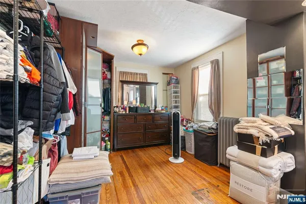 a bed room with a bed and a television