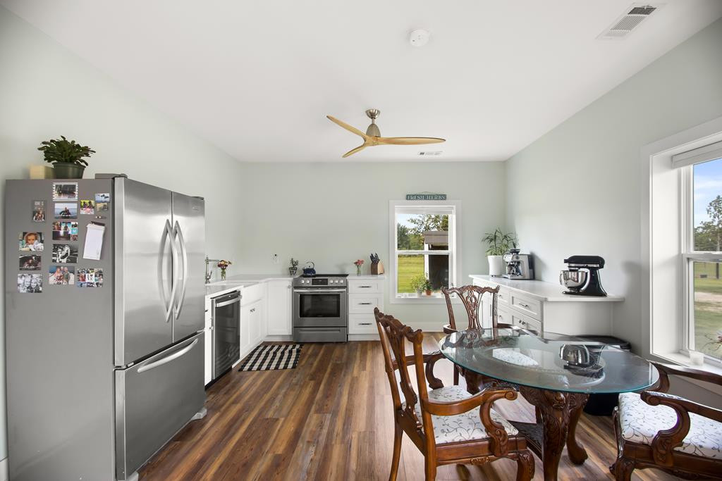 775 Colbert Bridge Road Windsor, SC 29856 - Photo 25 of 33 a view of a dining room with furniture window and wooden floor