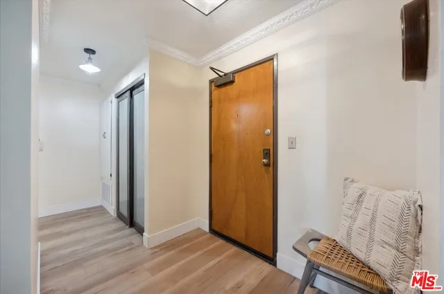 a view of room with furniture and wooden floor