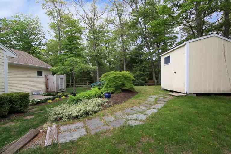 67 Old Farm Road Centerville, MA 02632 - Photo 23 of 23 a view of backyard with potted plants and large tree