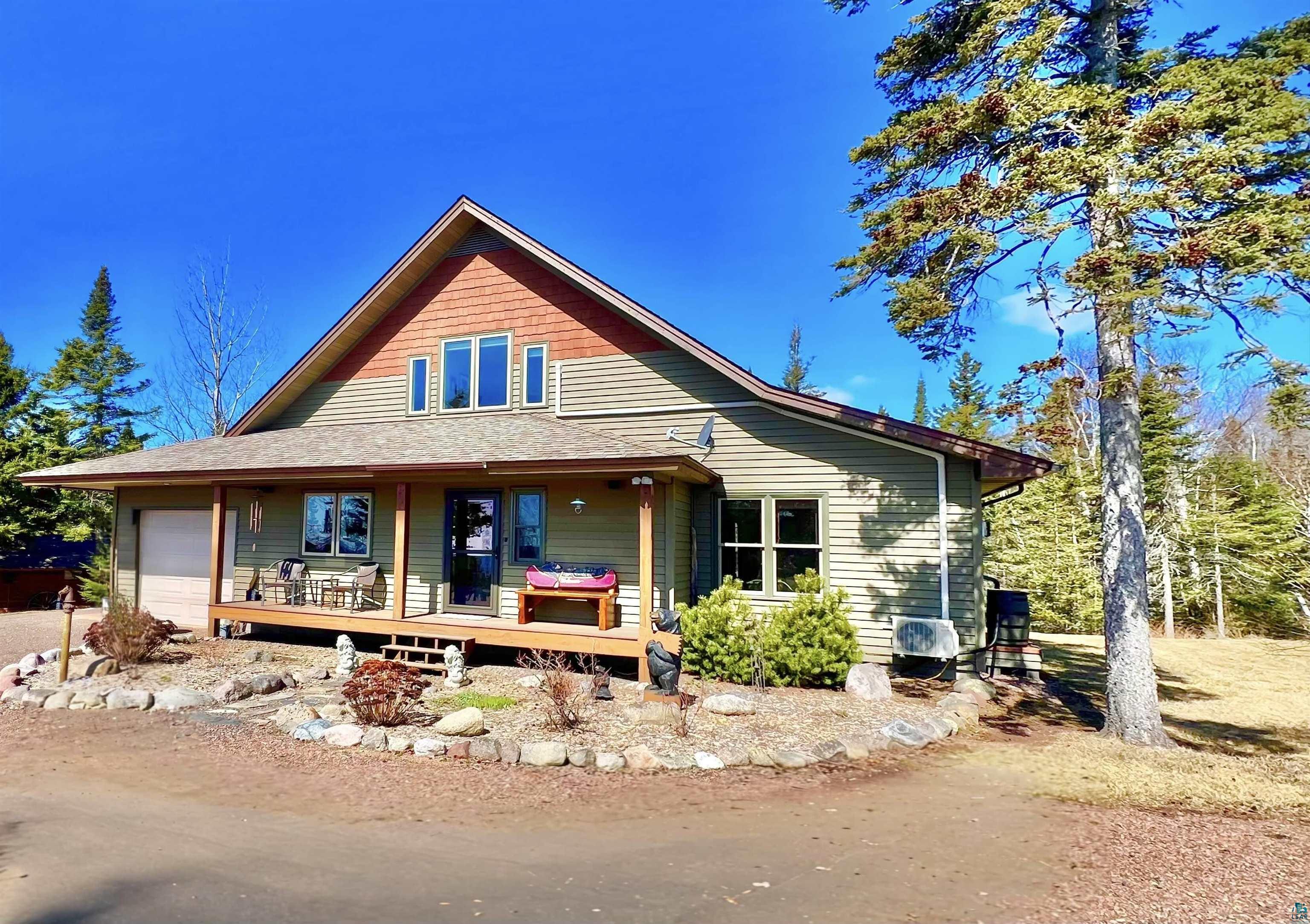 21 Turnagain Trail Lutsen, MN 55612 - Photo 2 of 77 Gable-roof property featuring horizontal siding and cedar shake accents