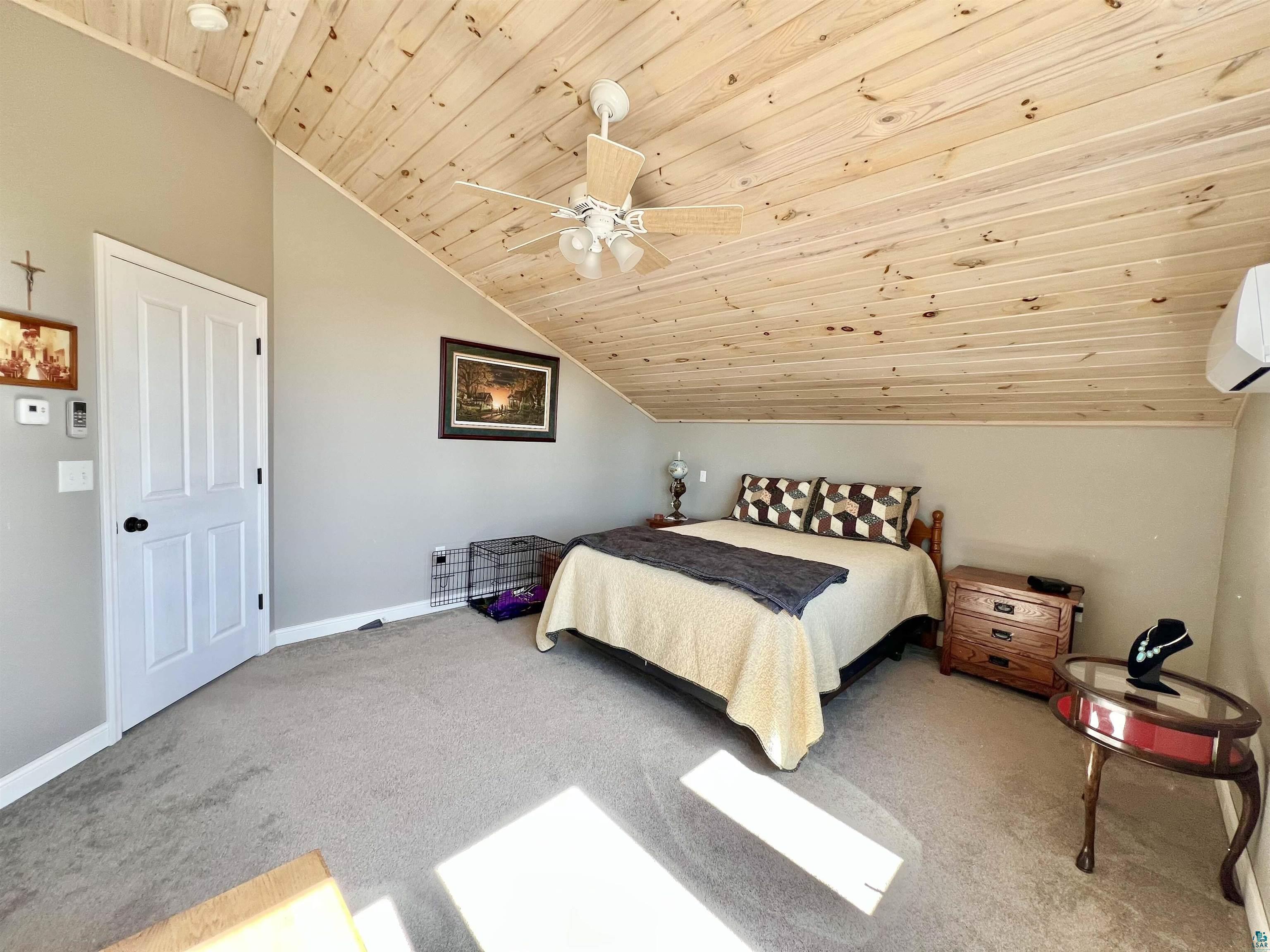 21 Turnagain Trail Lutsen, MN 55612 - Photo 34 of 77 Vaulted wood-paneled ceiling with a central ceiling fan