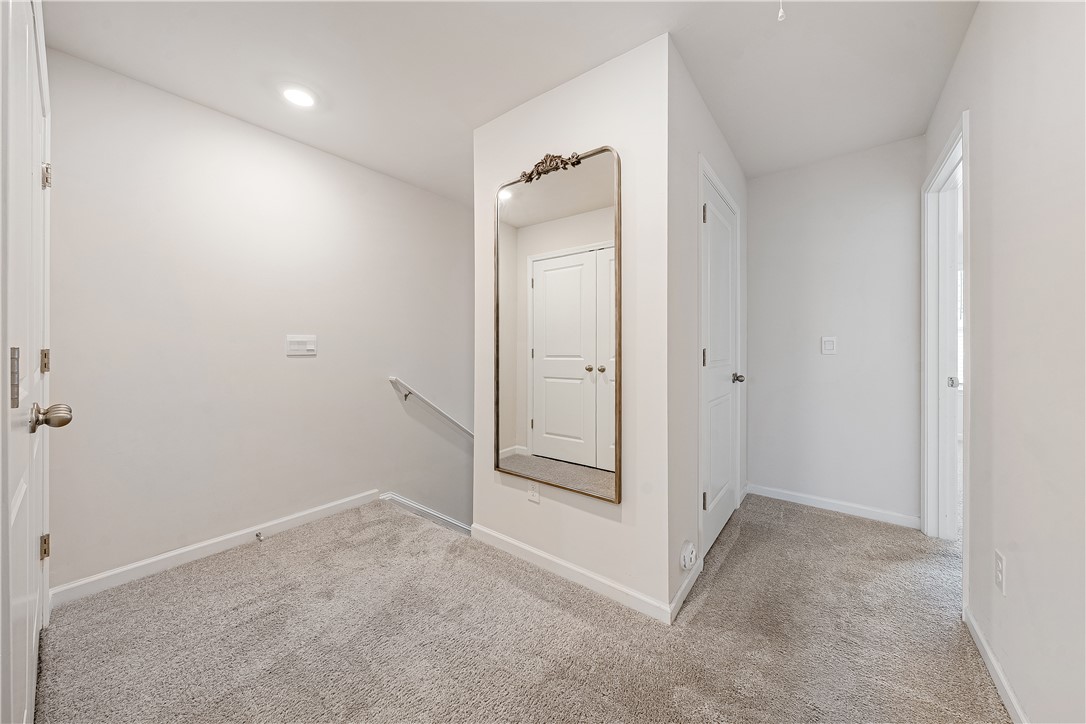 404 Oakmont Valley Trail Seneca, SC 29678 - Photo 16 of 44 This bright hallway connects spaces with clean lines and abundant light.