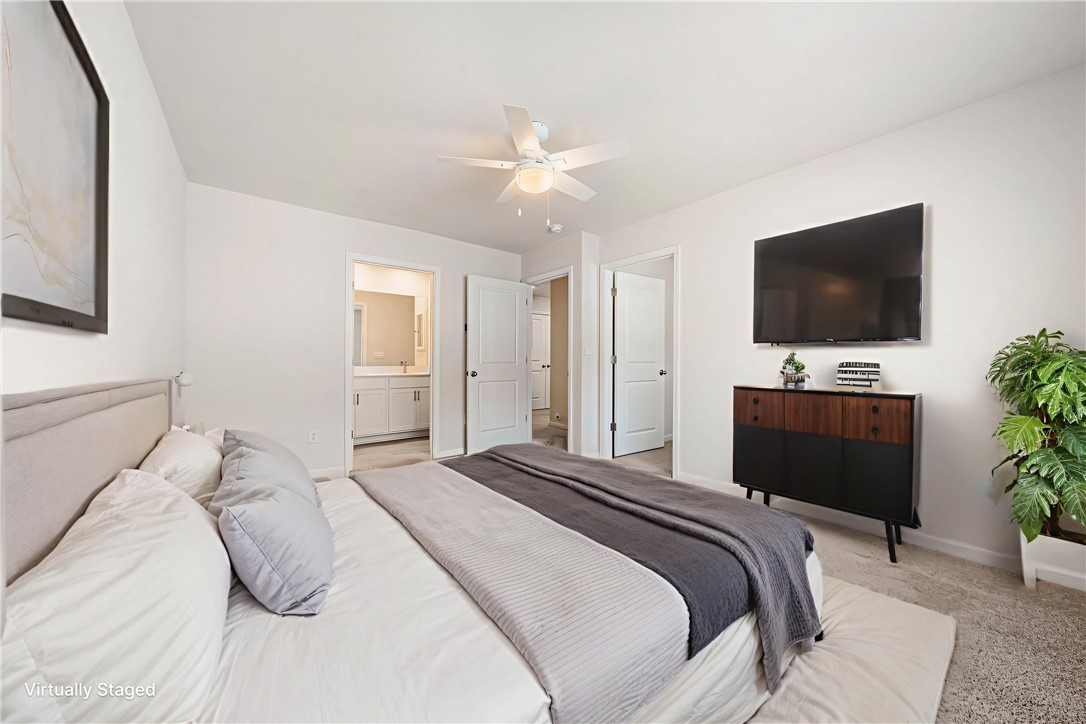 404 Oakmont Valley Trail Seneca, SC 29678 - Photo 19 of 44 This tranquil bedroom offers comfort and a private attached bathroom.