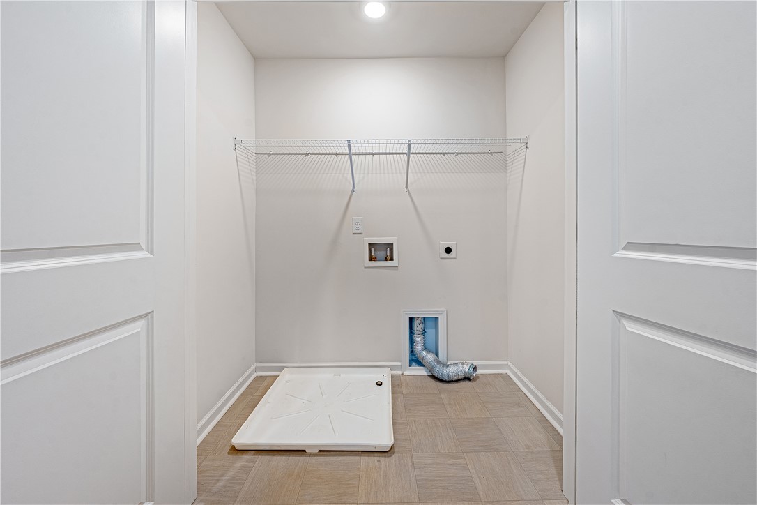 404 Oakmont Valley Trail Seneca, SC 29678 - Photo 30 of 44 This dedicated utility space offers practical organization and convenient hookups for your laundry needs.