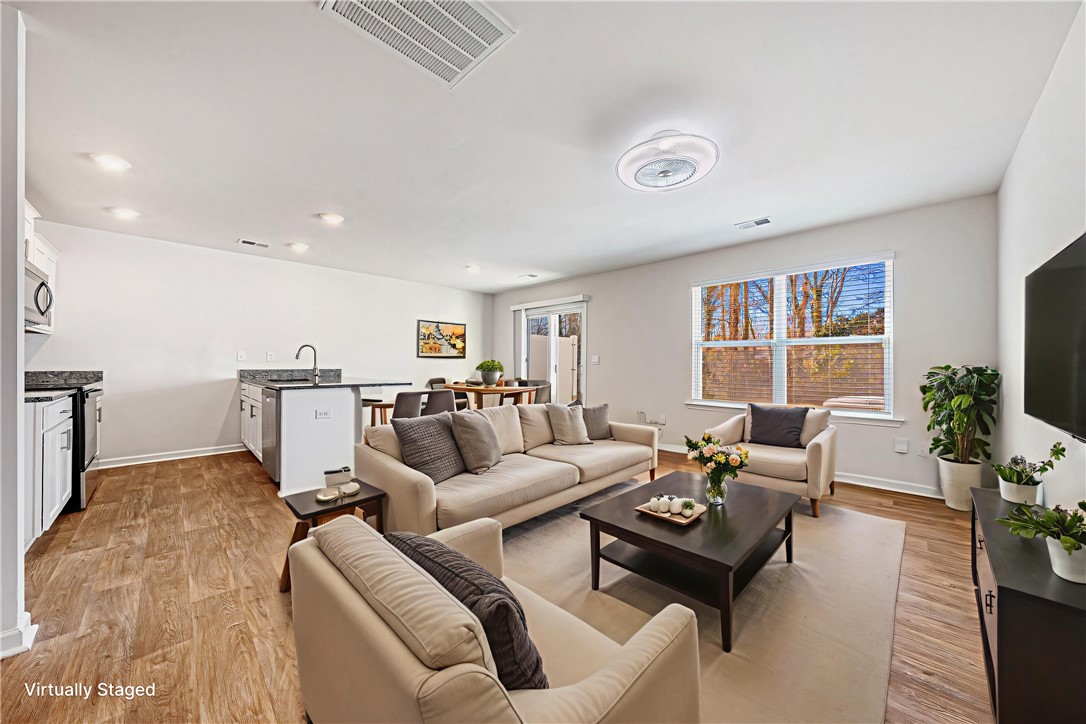 404 Oakmont Valley Trail Seneca, SC 29678 - Photo 5 of 44 This open concept living space features abundant natural light and seamless flow for comfortable living.