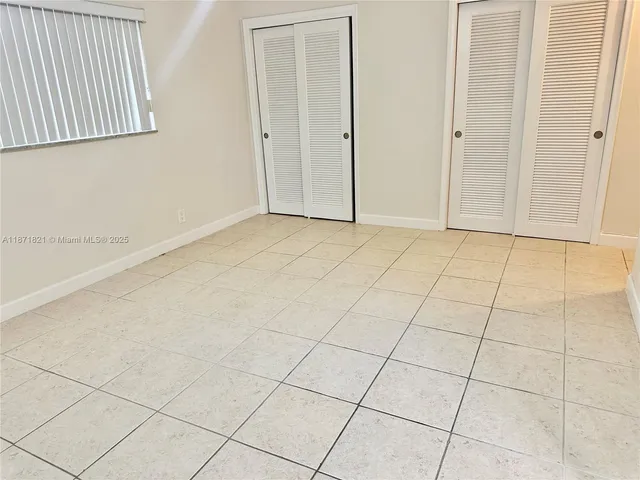 a view of an empty room and entryway