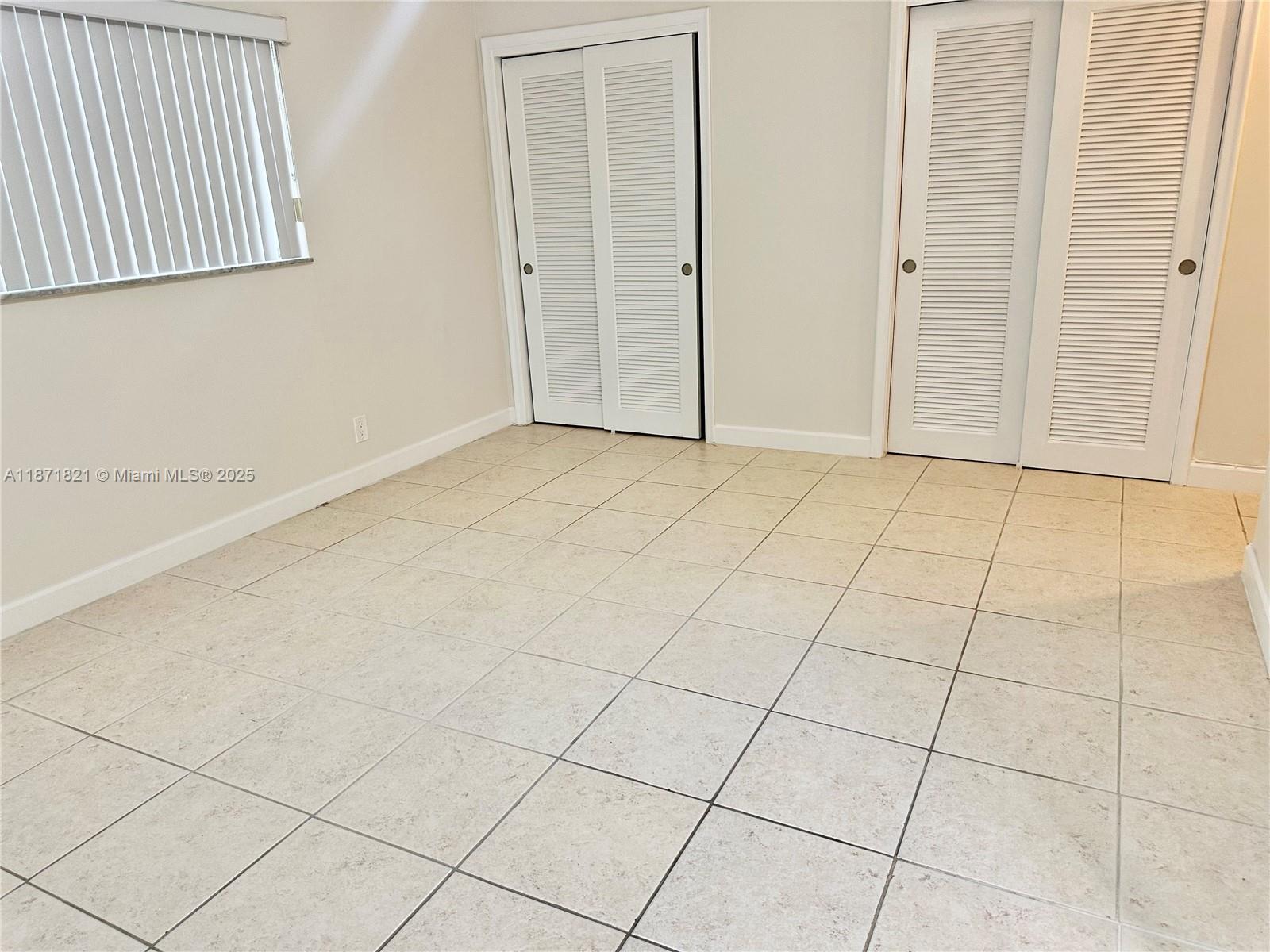 300 Northeast 12th Avenue, Unit 101 Hallandale Beach, FL 33009 - Photo 11 of 23 a view of an empty room and entryway