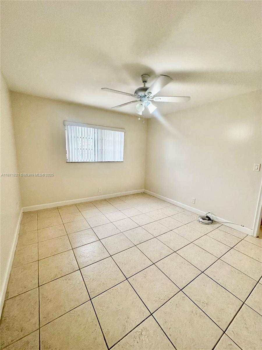 300 Northeast 12th Avenue, Unit 101 Hallandale Beach, FL 33009 - Photo 16 of 23 a view of an empty room and a window