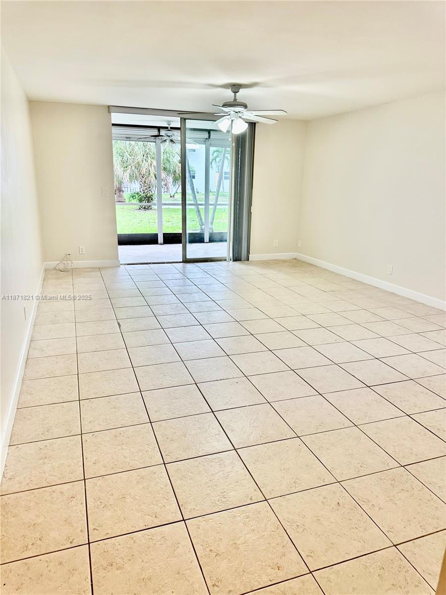 300 Northeast 12th Avenue, Unit 101 Hallandale Beach, FL 33009 - Photo 18 of 23 a view of an empty room and a window