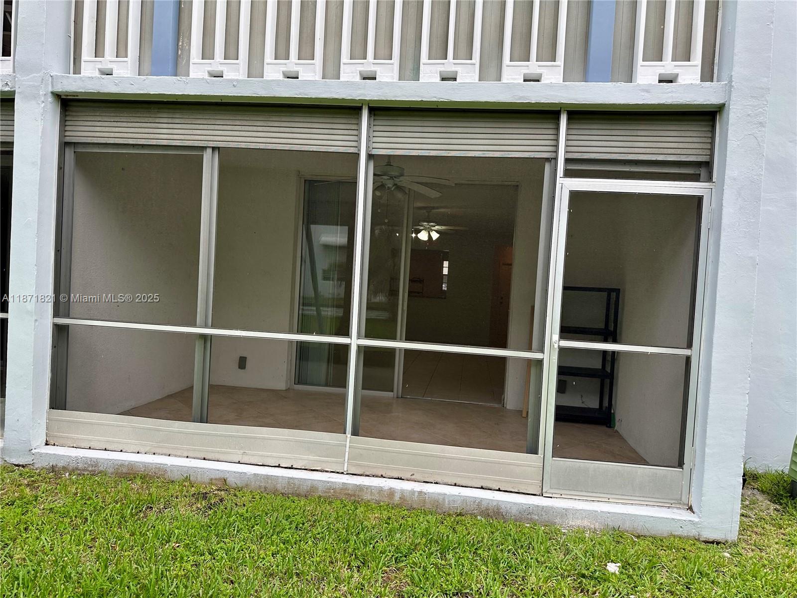 300 Northeast 12th Avenue, Unit 101 Hallandale Beach, FL 33009 - Photo 19 of 23 a view of outdoor space with sliding door