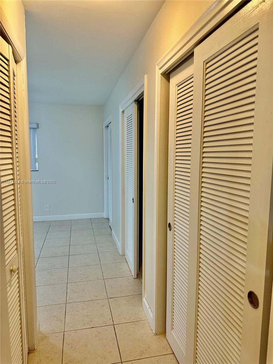 300 Northeast 12th Avenue, Unit 101 Hallandale Beach, FL 33009 - Photo 7 of 23 a view of a livingroom with a window