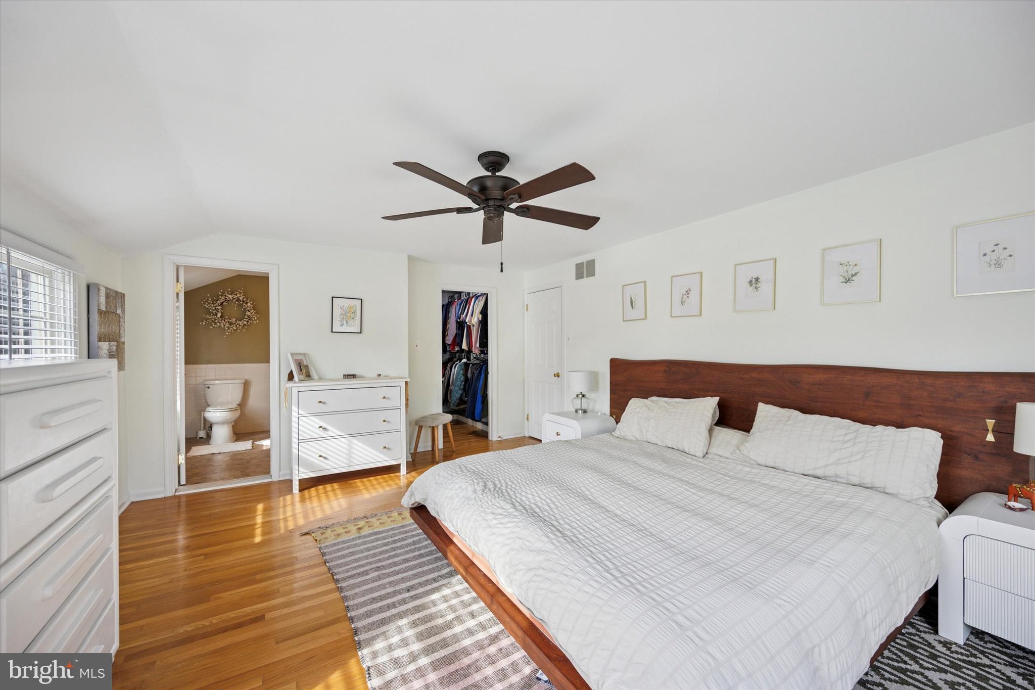 22 Schoolhouse Drive Medford, NJ 08055 - Photo 16 of 26 a bedroom with a bed and wooden floor