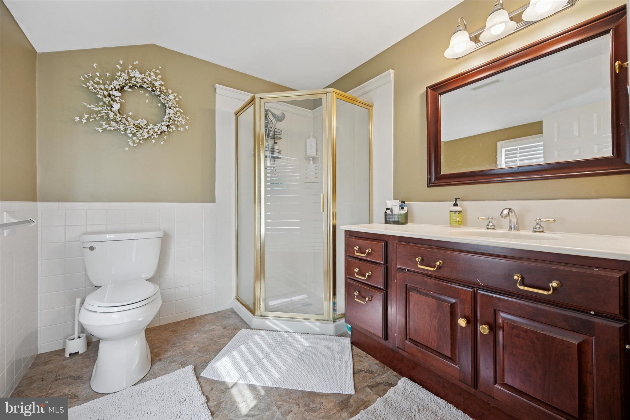 22 Schoolhouse Drive Medford, NJ 08055 - Photo 21 of 26 a bathroom with a sink a toilet and shower