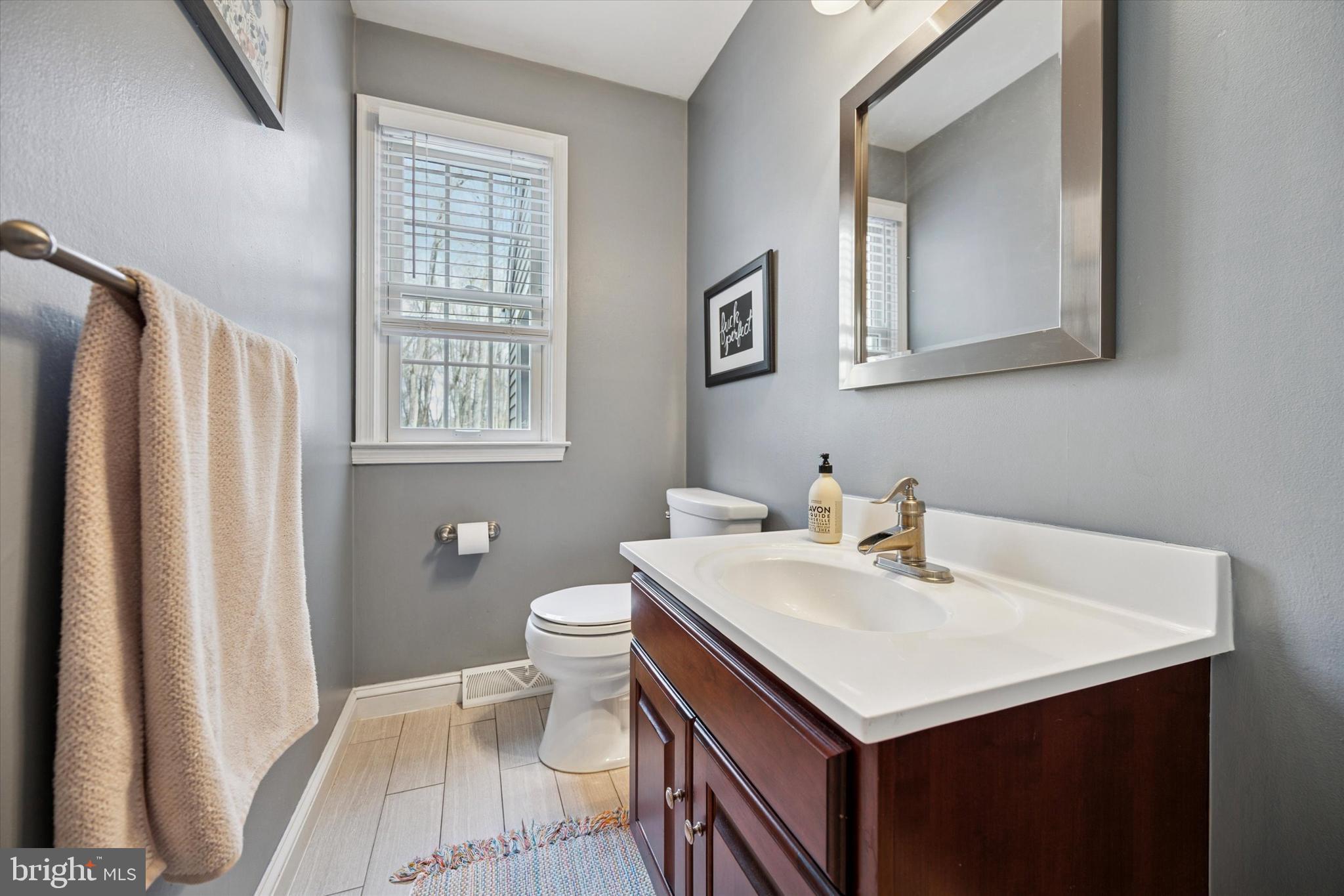 22 Schoolhouse Drive Medford, NJ 08055 - Photo 22 of 26 a bathroom with a sink toilet and mirror