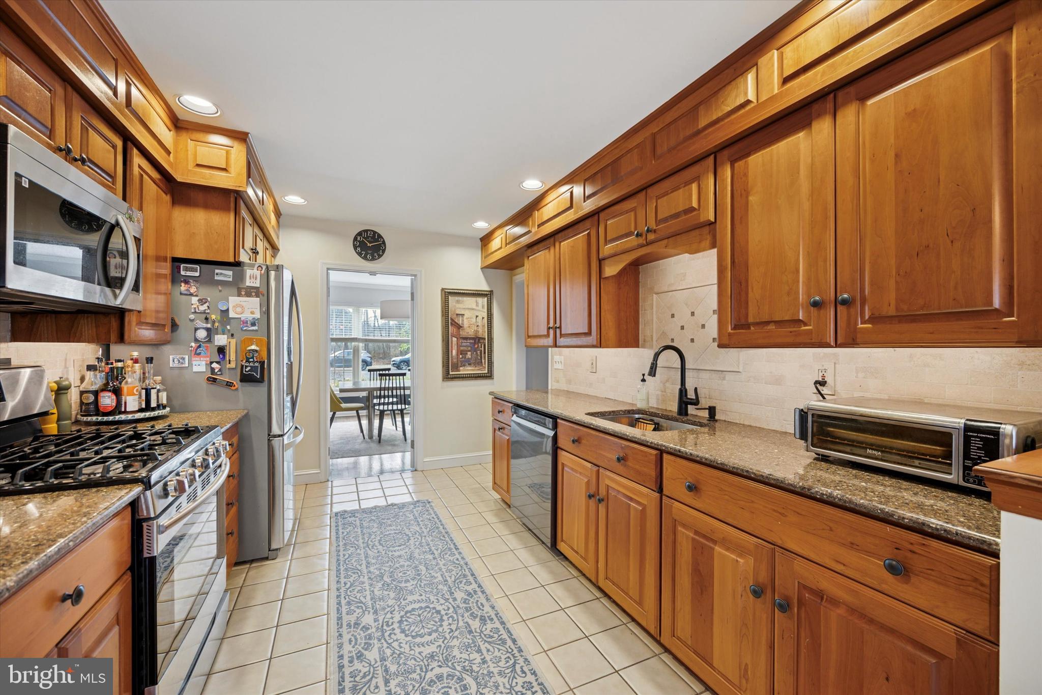 22 Schoolhouse Drive Medford, NJ 08055 - Photo 10 of 26 a kitchen with stainless steel appliances a sink stove and cabinets