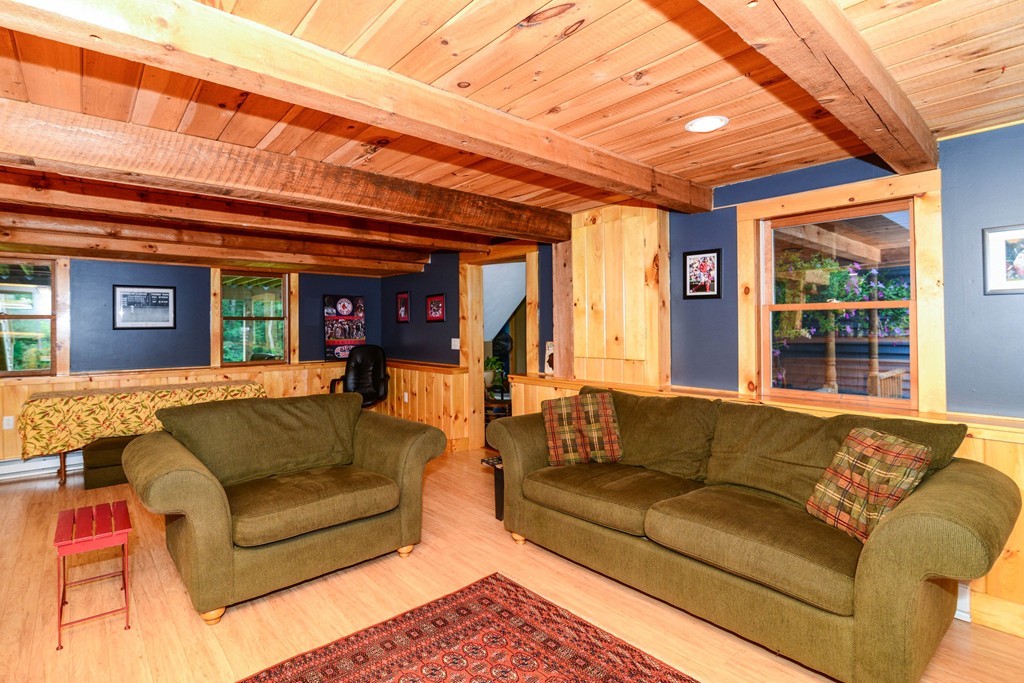 180 Hartness Road Sutton, MA 01590 - Photo 7 of 30 a living room with furniture and a large window