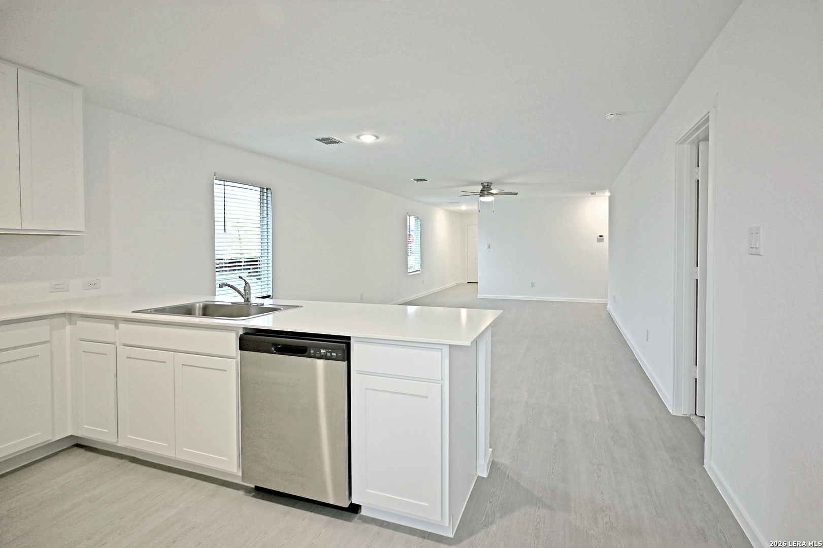 9902 Mather Way Converse, TX 78109 - Photo 6 of 18 a kitchen with a sink and cabinets