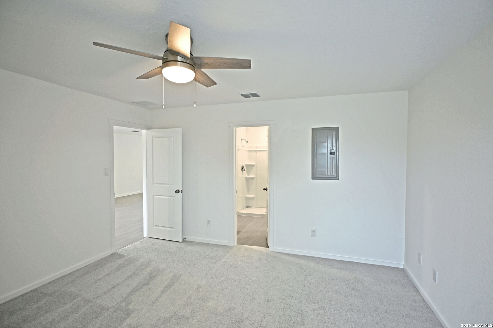 9902 Mather Way Converse, TX 78109 - Photo 8 of 18 an empty room with chandelier fan and windows