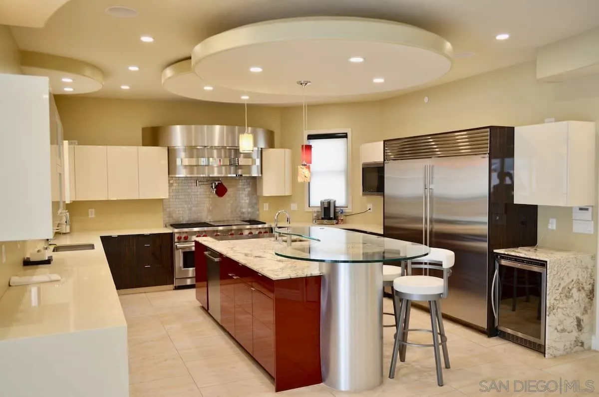 1235 Neptune Avenue Encinitas, CA 92024 - Photo 1 of 32 a large kitchen with a large counter top appliances and cabinets