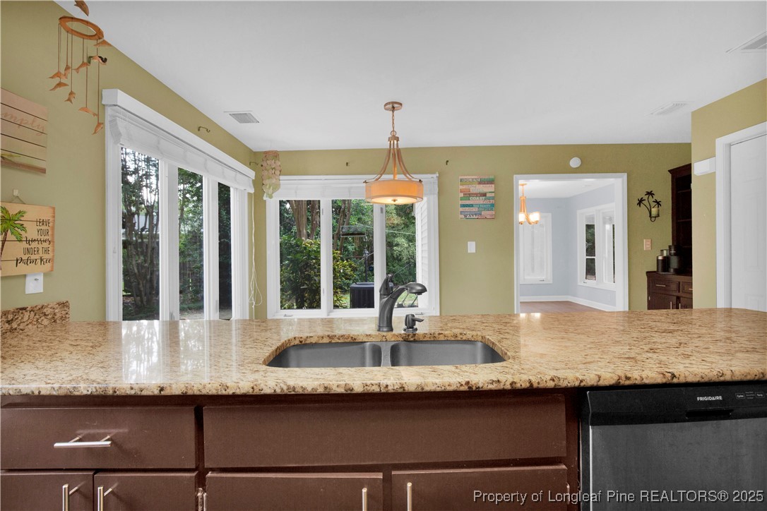 2375 Raeford Road Fayetteville, NC 28305 - Photo 16 of 39 a kitchen with granite countertop sink and window