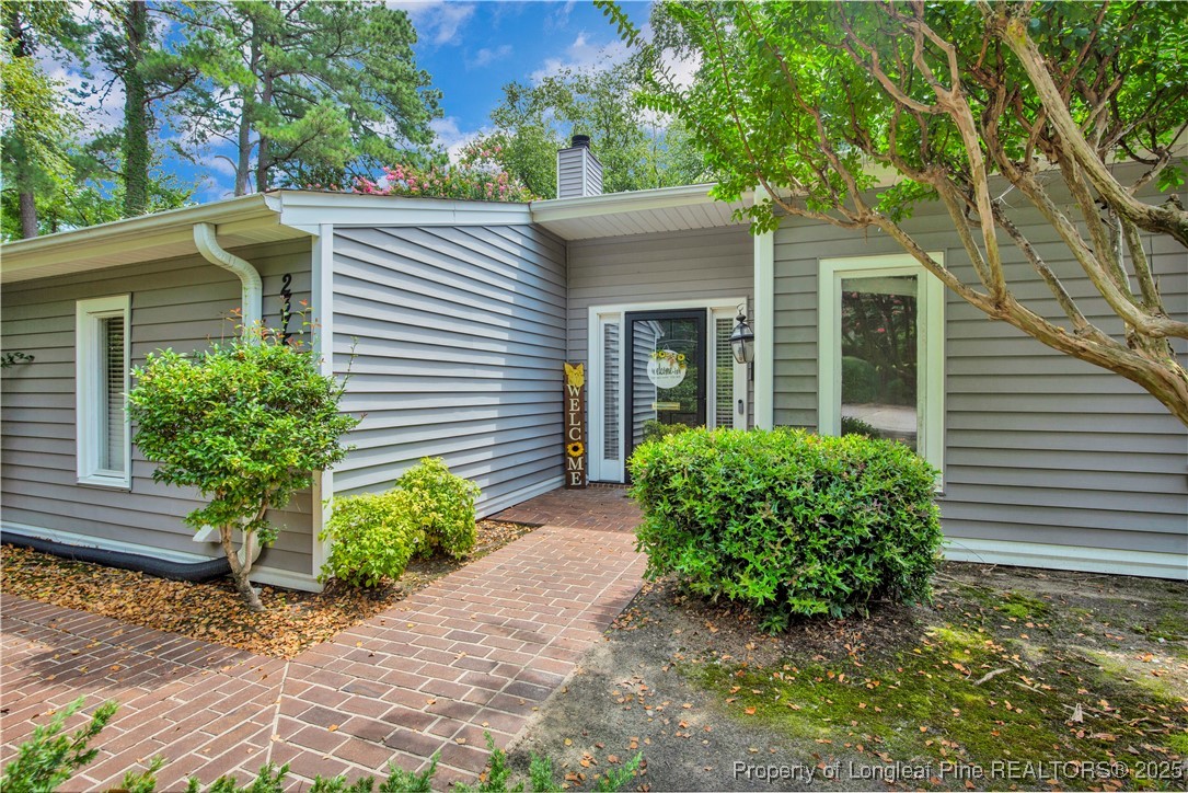 2375 Raeford Road Fayetteville, NC 28305 - Photo 29 of 39 a front view of a house with garden