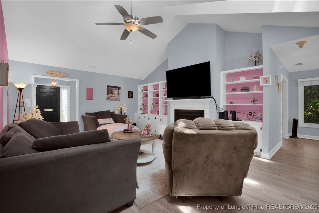 2375 Raeford Road Fayetteville, NC 28305 - Photo 8 of 39 a living room with fireplace furniture and a flat screen tv