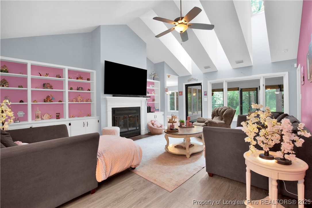 2375 Raeford Road Fayetteville, NC 28305 - Photo 9 of 39 a living room with furniture fireplace and a flat screen tv
