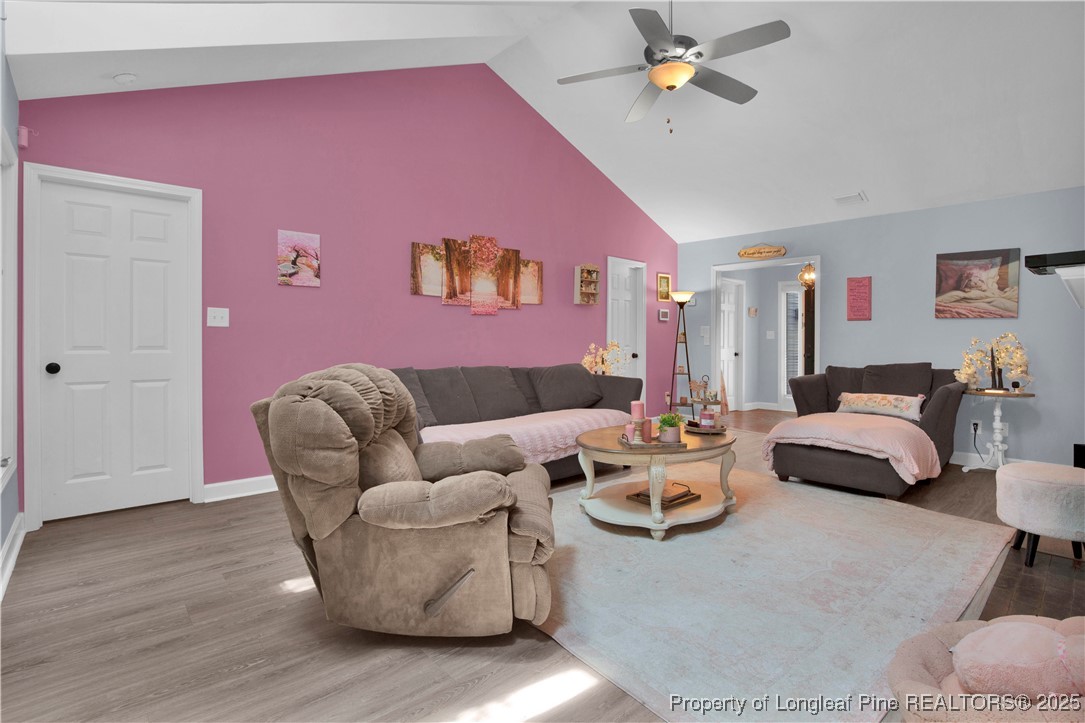 2375 Raeford Road Fayetteville, NC 28305 - Photo 10 of 39 a living room with furniture and a wooden floor