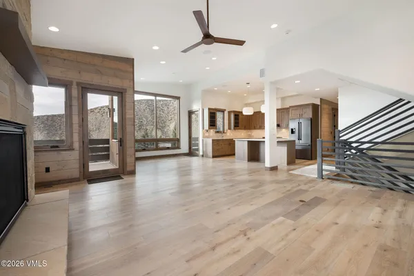 a view of a kitchen with a stove and a large window