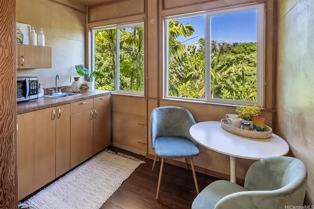 a kitchen with a table and chairs