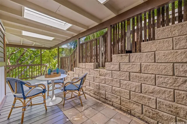 a view of a two chairs in the balcony