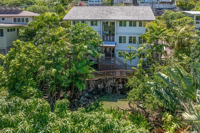 an aerial view of a house with a garden