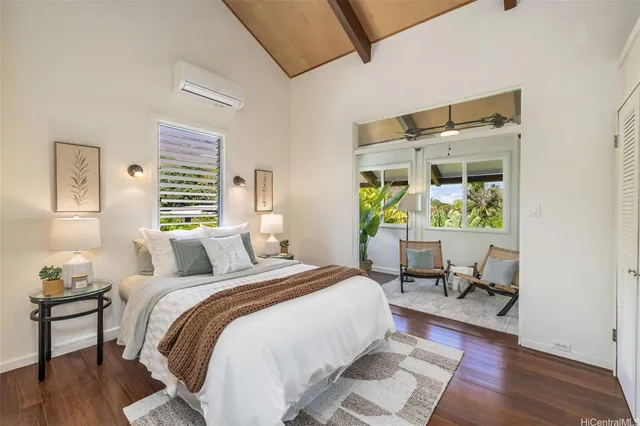 a bed room with a bed and a chair