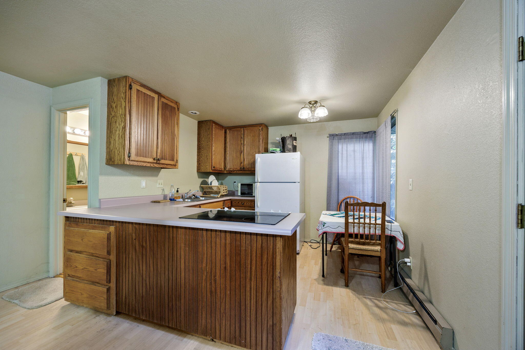75 Wimer Street Ashland, OR 97520 - Photo 38 of 44 a kitchen with a sink cabinets and wooden floor