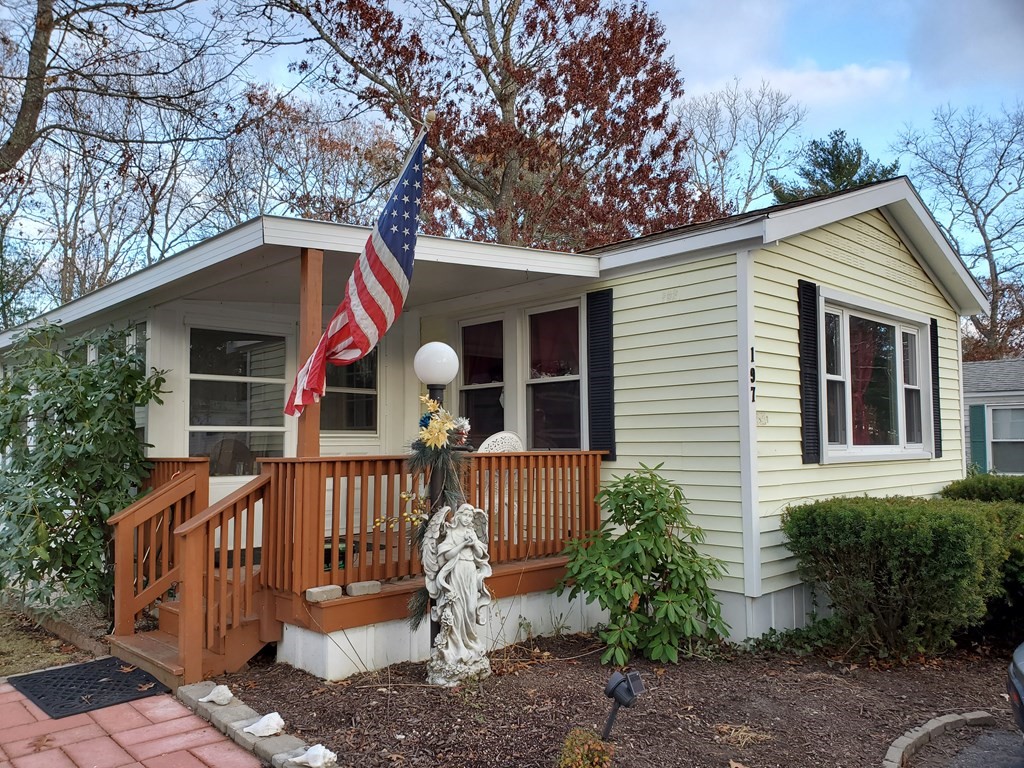 197 Windswept Road Wareham, MA 02571 - Photo 1 of 26 a table and chairs in front of house