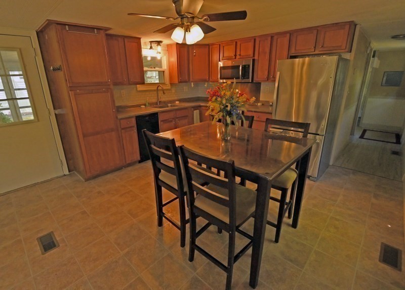 197 Windswept Road Wareham, MA 02571 - Photo 10 of 26 a dining table with chairs and cabinets