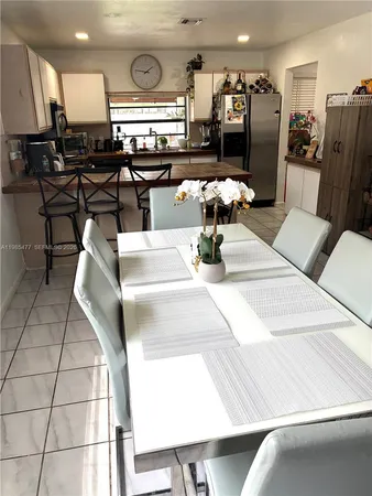a lobby with furniture and lots of wooden furniture
