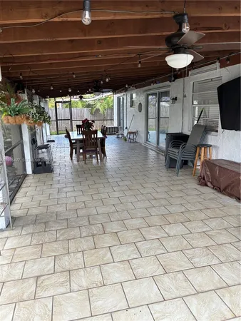 a view of a patio with table and chairs