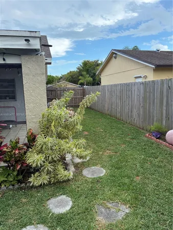 a view of a backyard with plants
