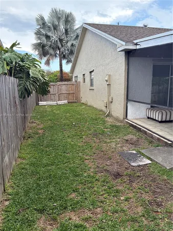 a house view with a backyard space