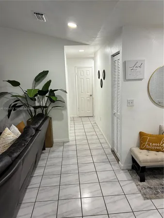 a living room with furniture and a rug