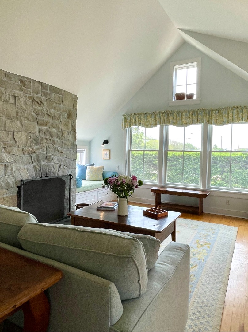 155 Surfside Road Nantucket, MA 02554 - Photo 11 of 60 a living room with fireplace furniture and a large window