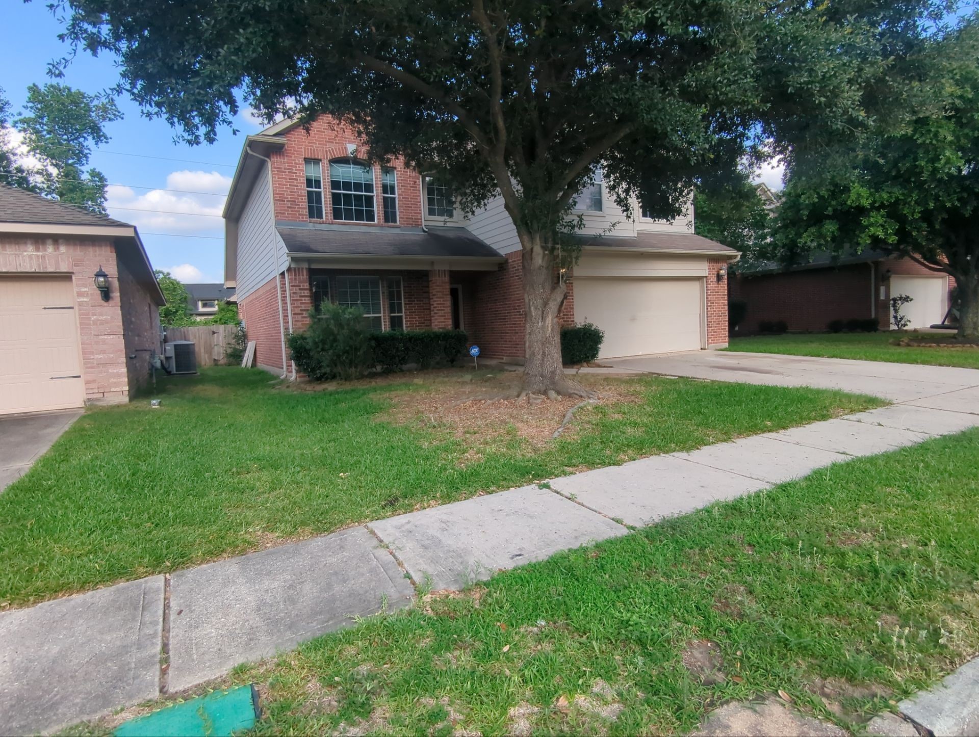 21850 Catoosa Drive Spring, TX 77388 - Photo 3 of 15 a front view of a house with a garden and yard